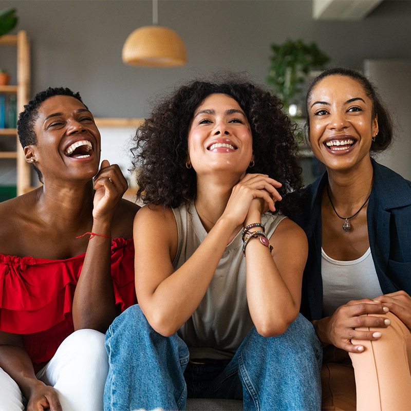 A Group Of Young Adult Black Women In The Living Room